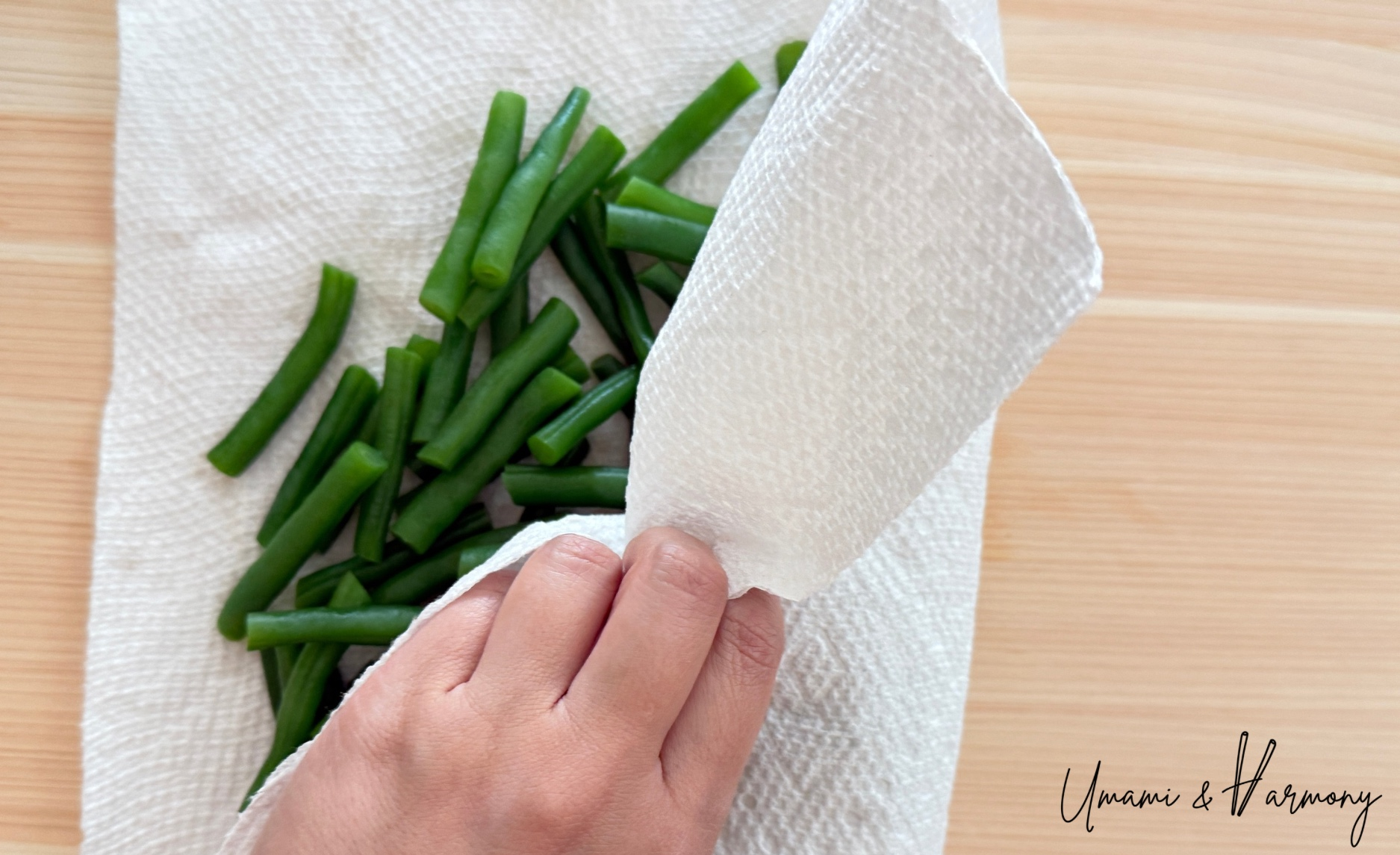 Gently pat the green beans dry with a paper towel.