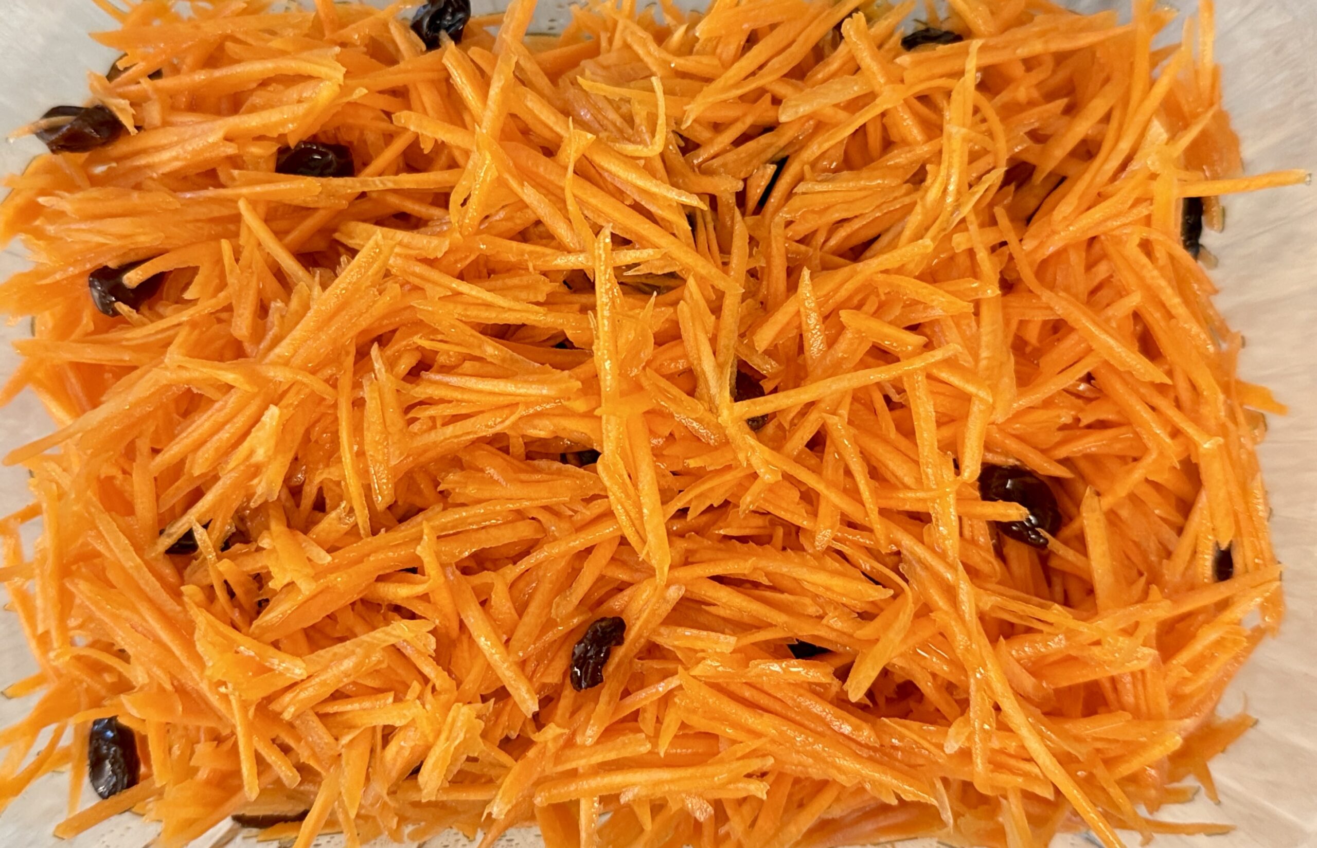 Quick carrot salad served in a glass container