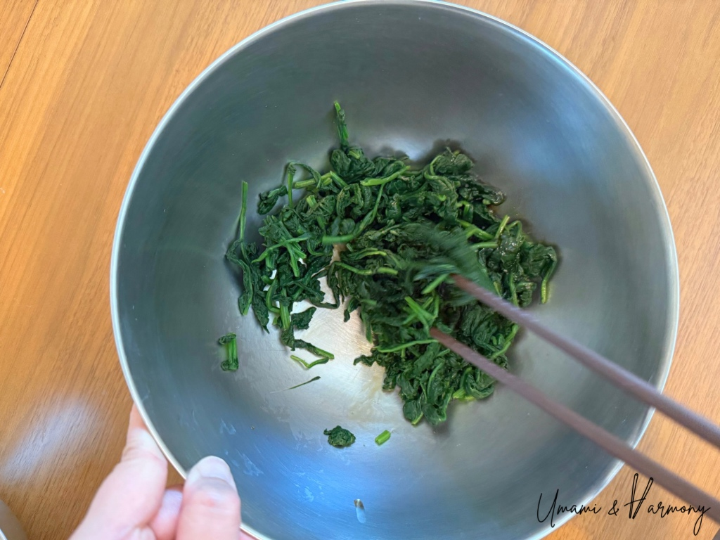 Spinach tossed in soy-maple dressing