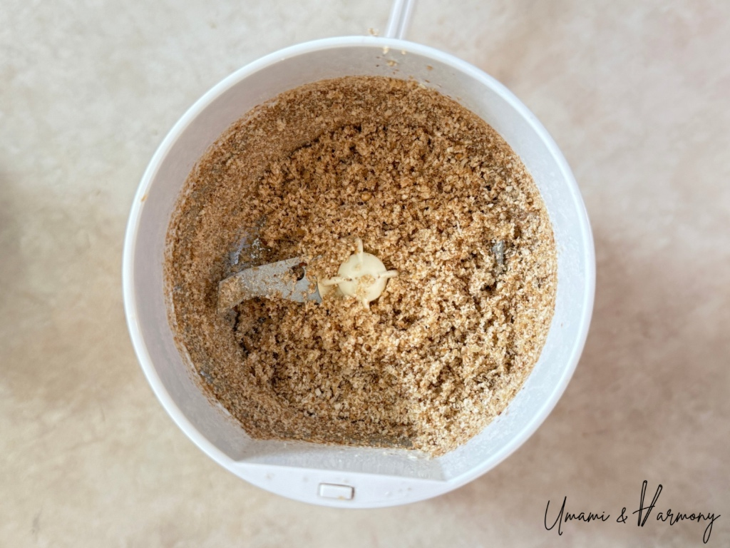 Ground sesame seeds in a food grinder after grinding