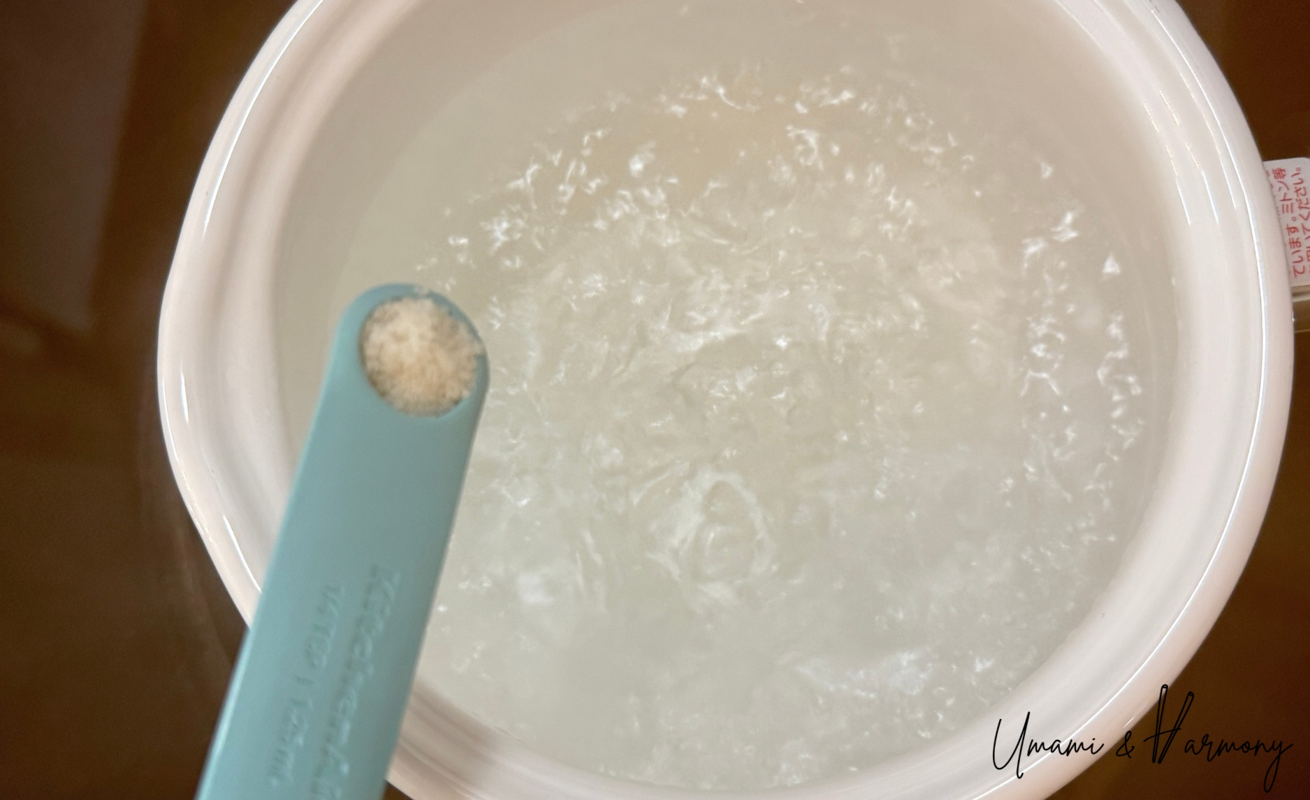 Salt being poured into a pot of boiling water.