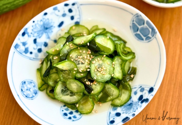 Japanese cucumber and wakame salad served in a small dish, topped with sesame seeds