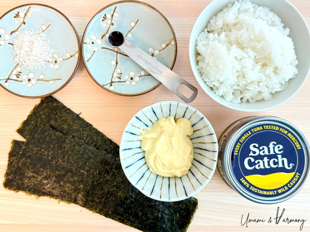 Ingredients for tuna mayo onigiri: cooked Japanese rice, tuna can, mayonnaise, nori sheets, salt and soy sauce.