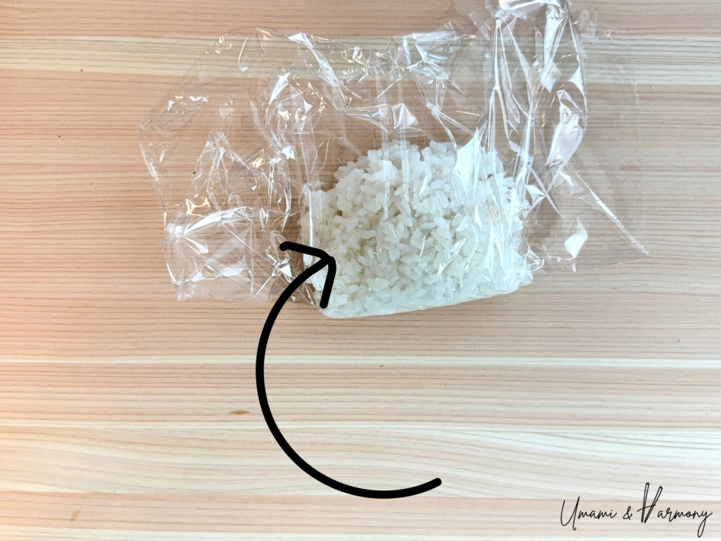 Bottom half of the rice folded over the tuna to sandwich the filling.