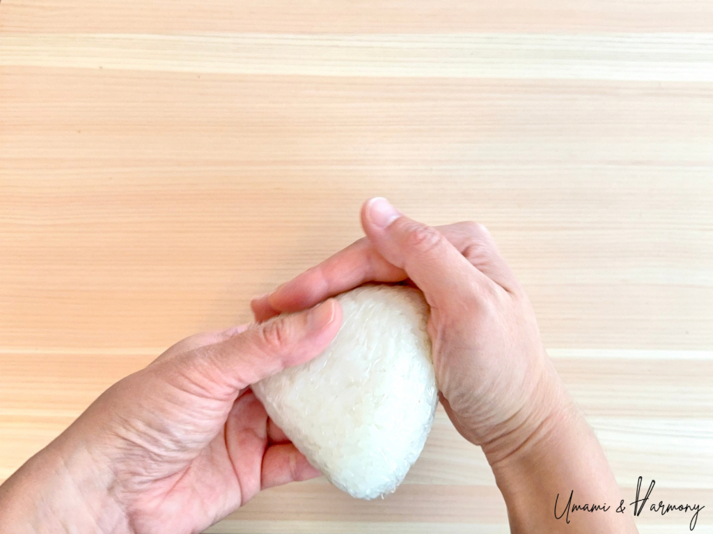 Rice rotated while forming the triangle shape.