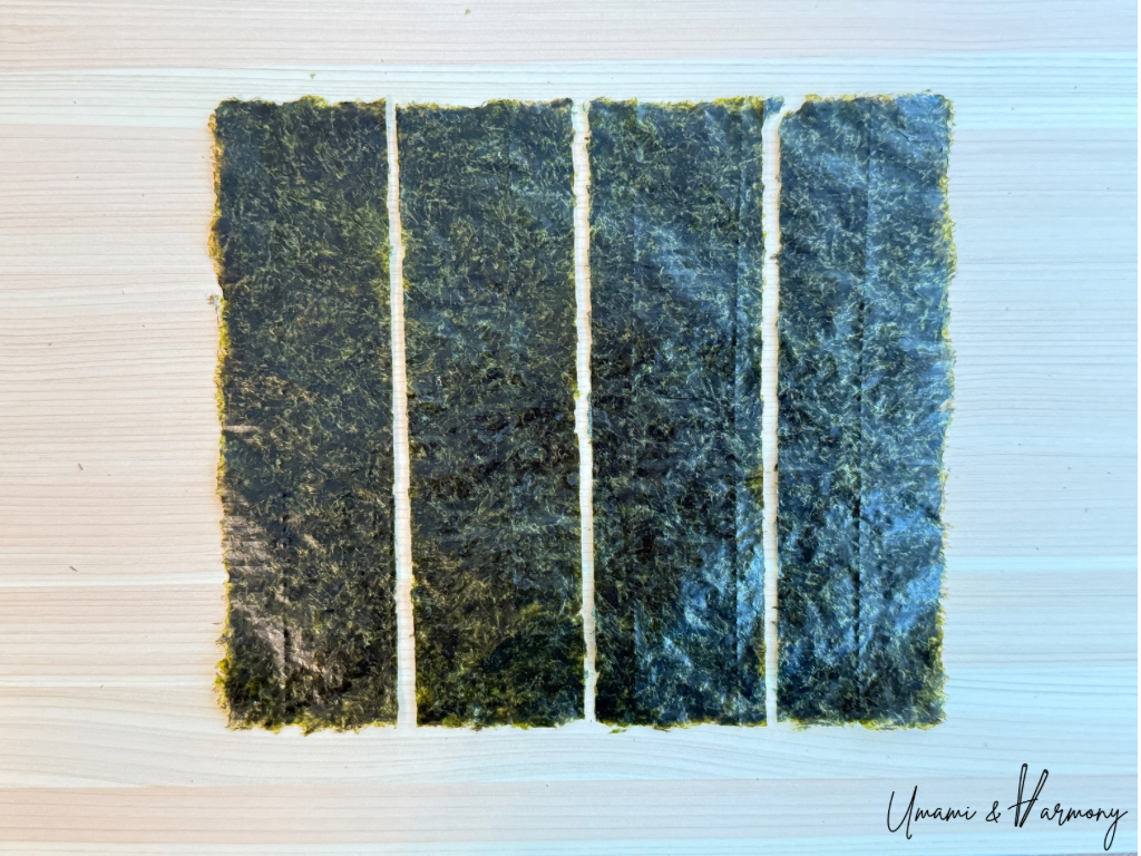One full-sized sheet of nori cut into four strips.