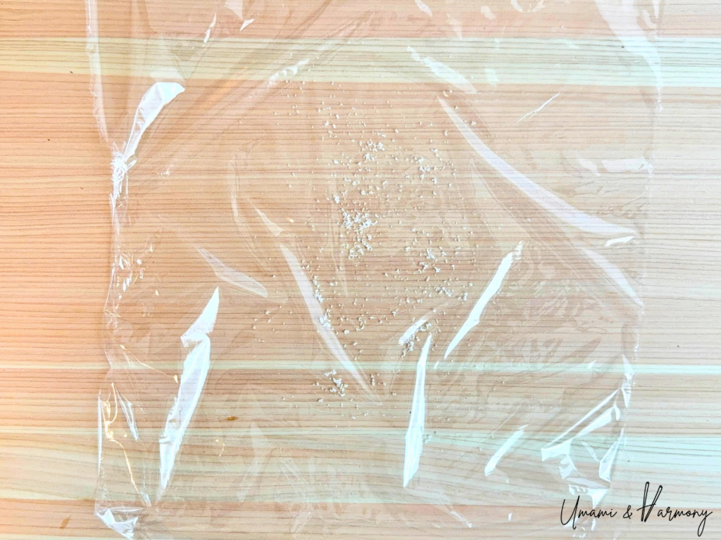 Salt sprinkled over the plastic wrap.