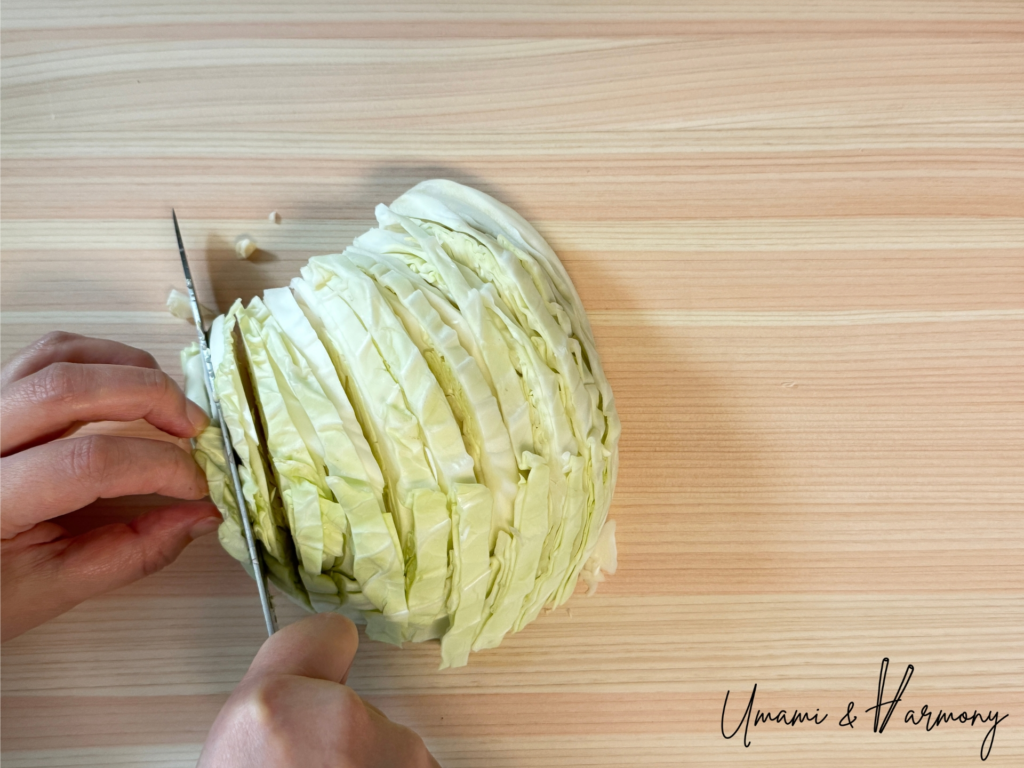Slicing cabbage before chopping for gyoza filling