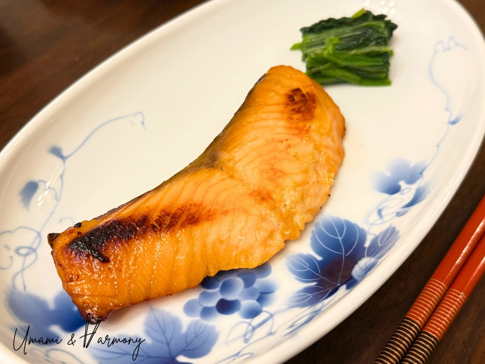 Baked miso salmon served on a Japanese tray with spinach side dish