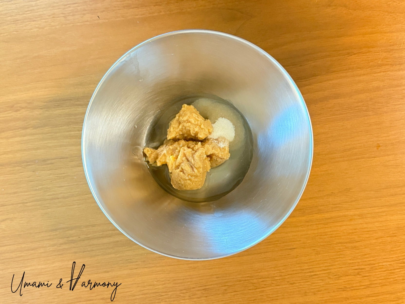 Miso, sake, mirin, and sugar combined in a bowl