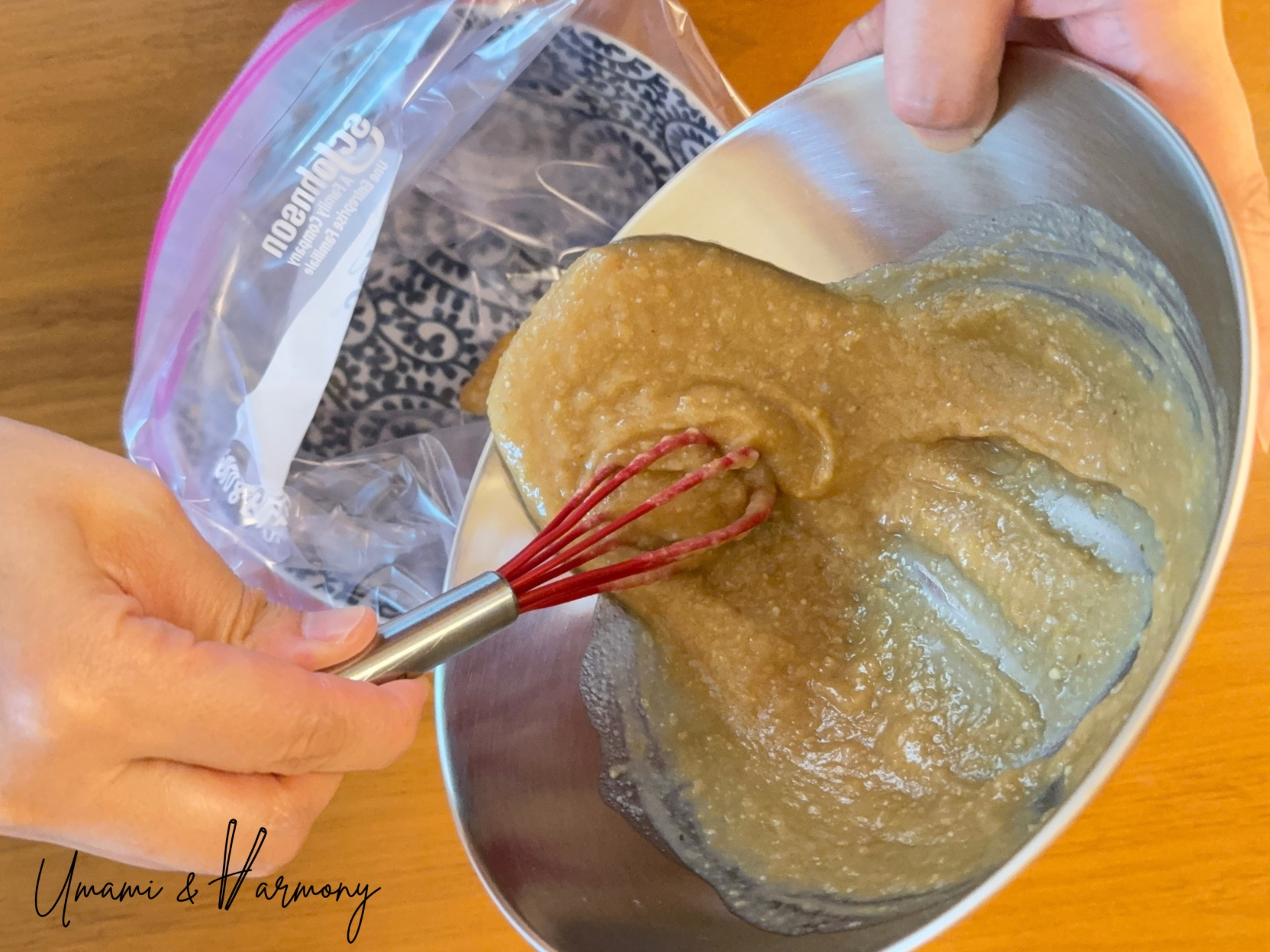 Miso marinade being transferred into a plastic zip bag