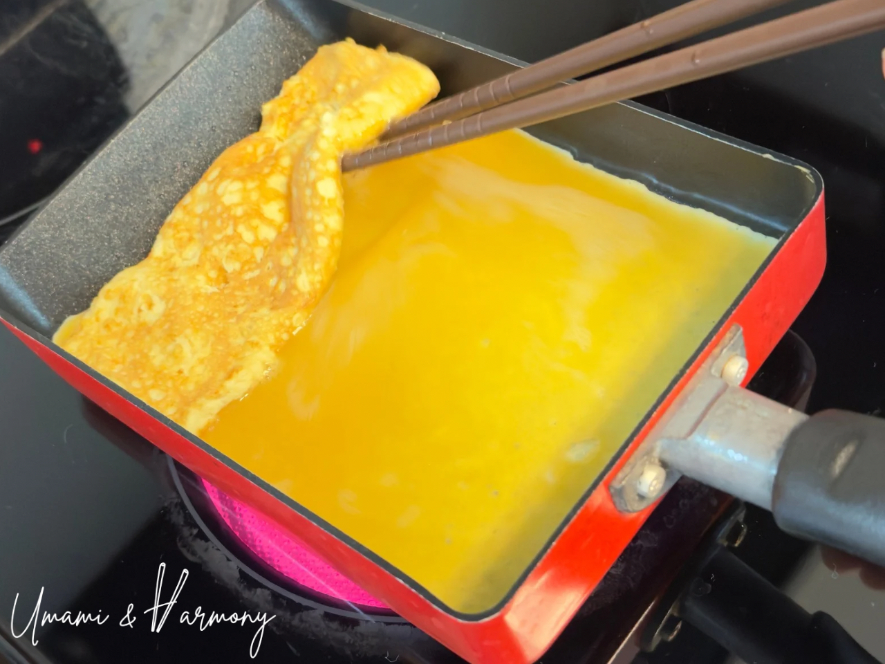 Second layer of tamagoyaki egg mixture poured into pan