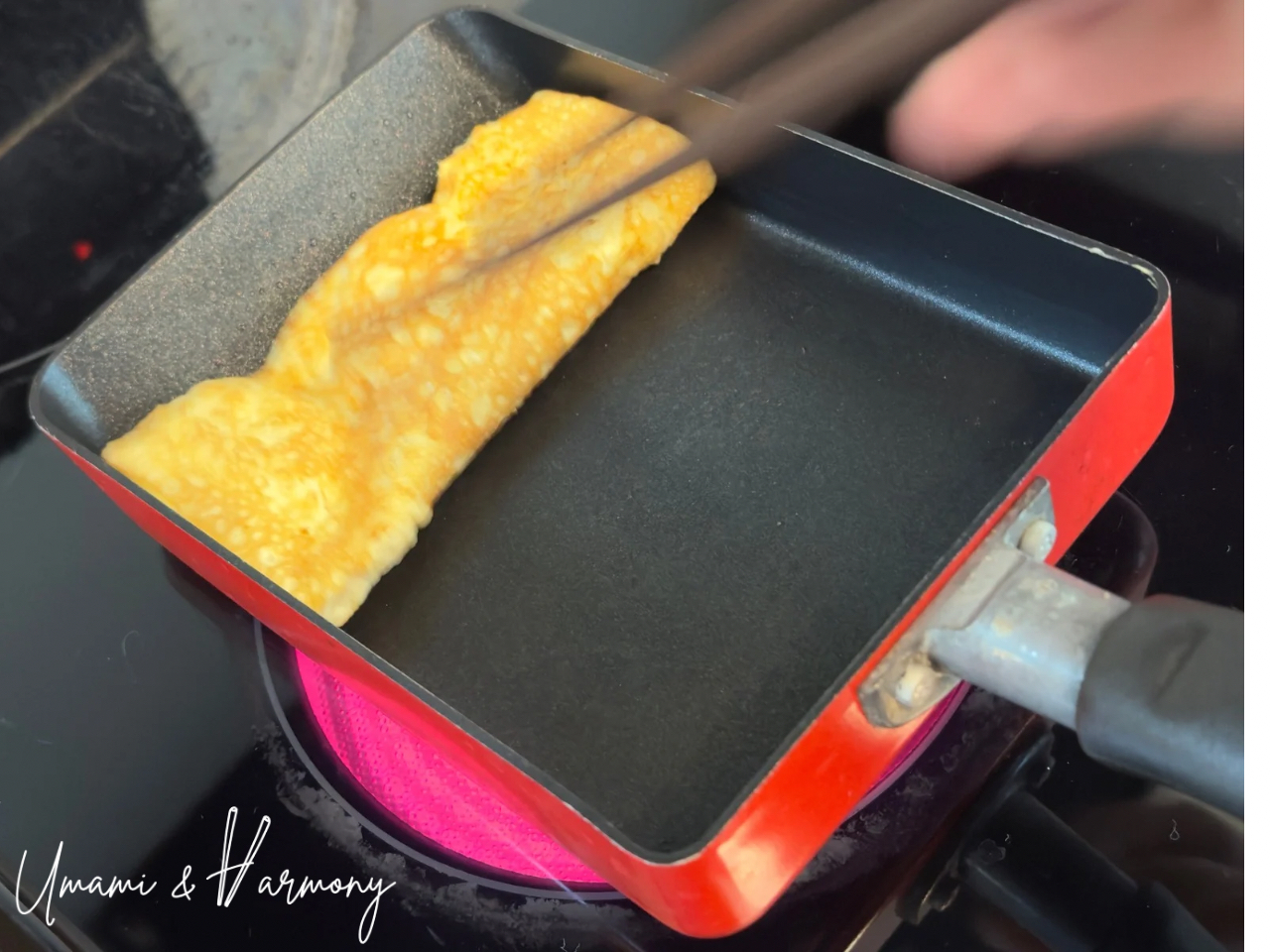 Tamagoyaki first layer rolled with chopsticks