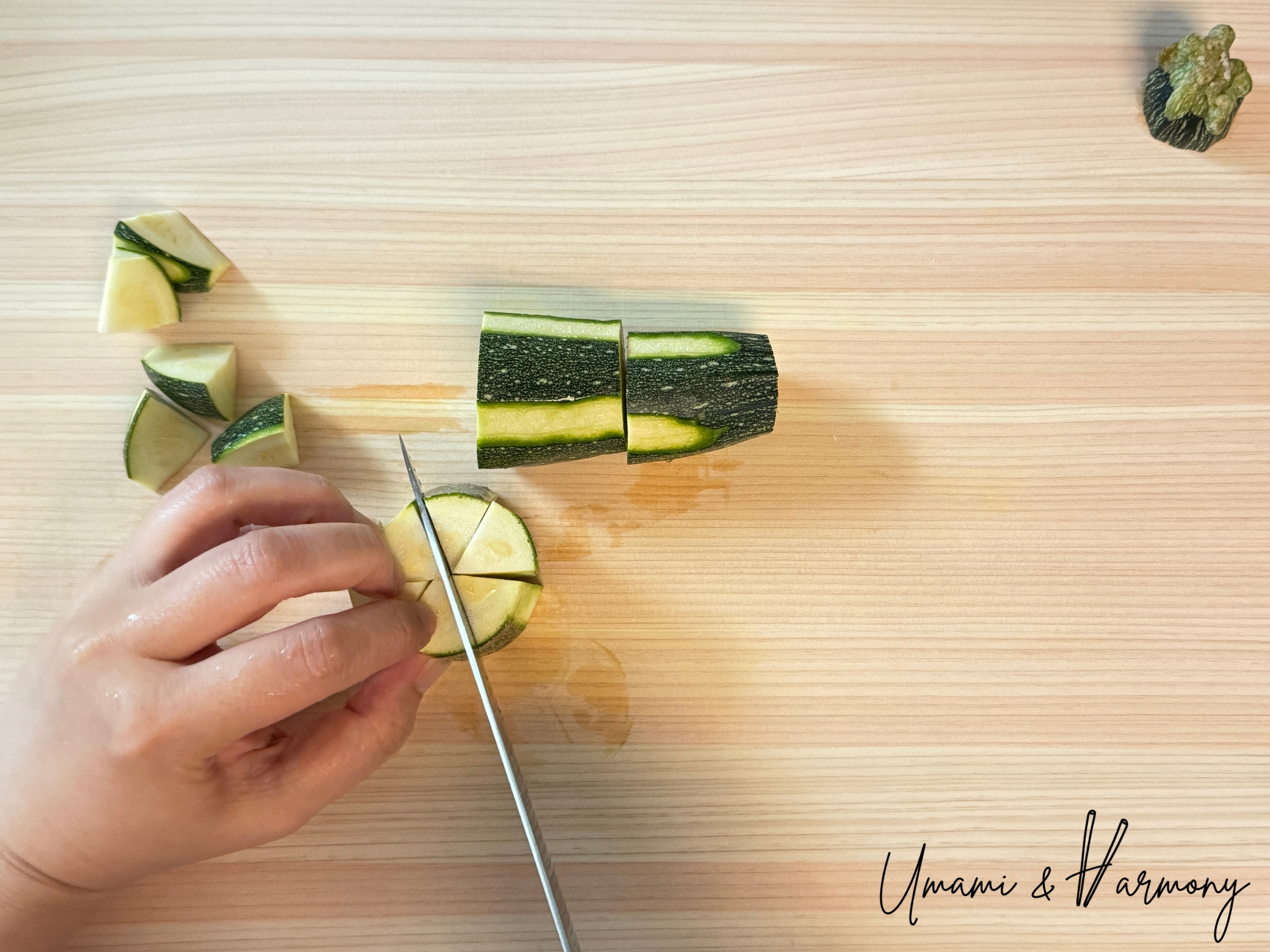 Cutting zucchini into wedges on a cutting board