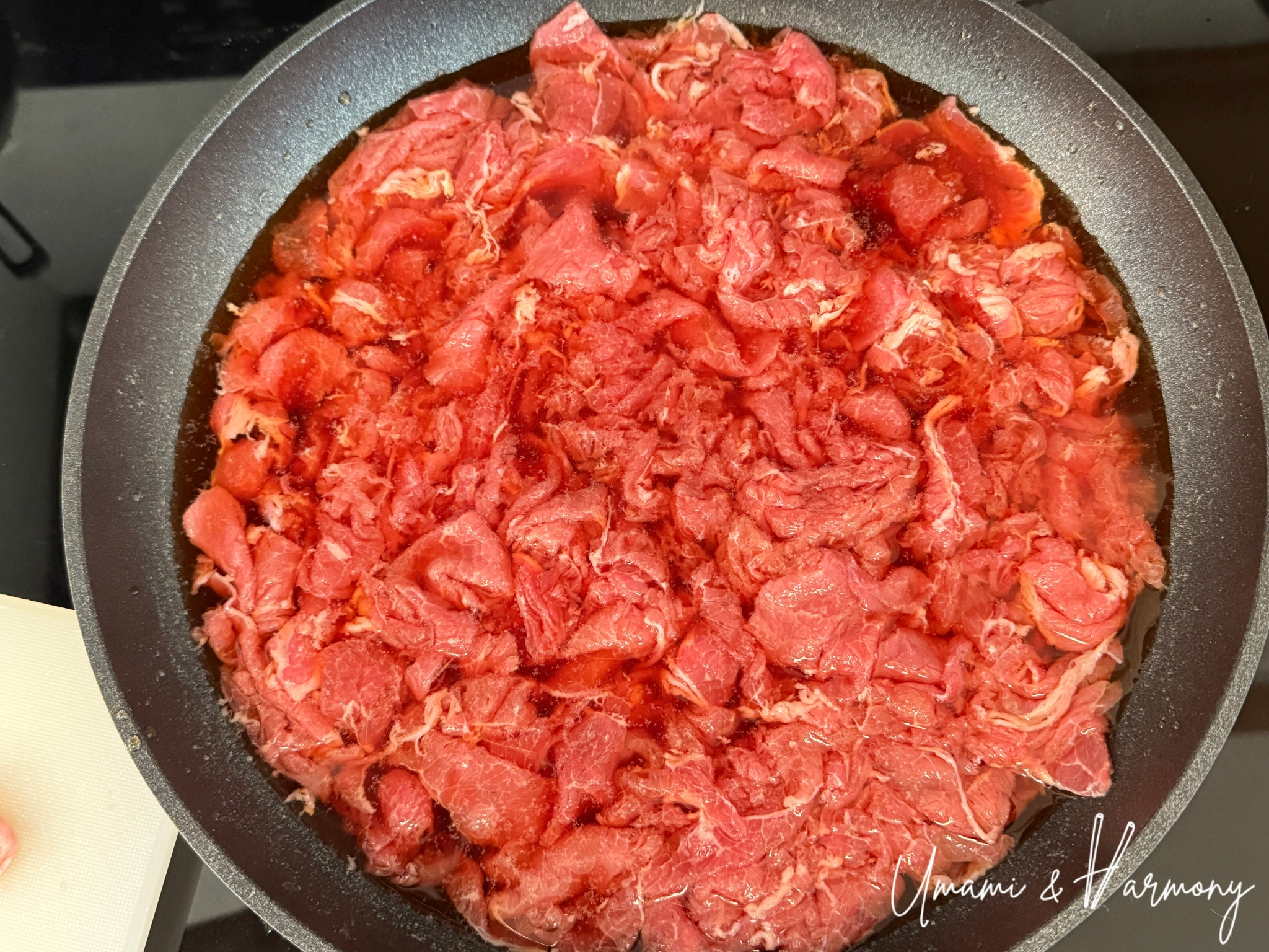 All beef added into the skillet with sauce for Gyudon