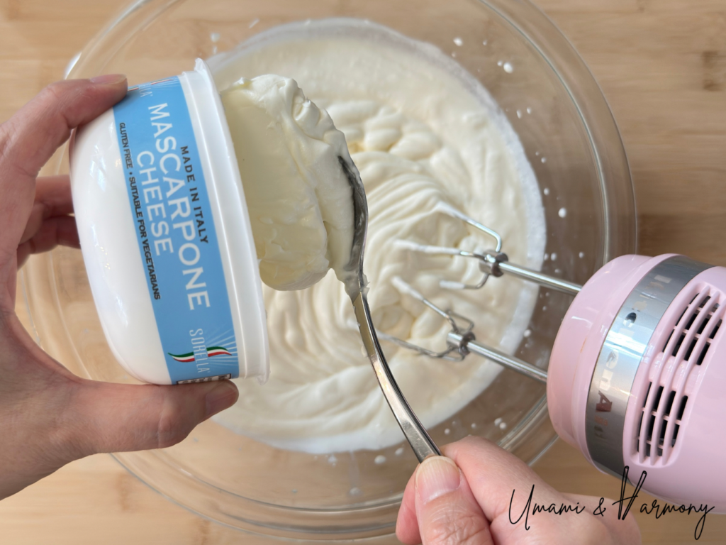 Adding mascarpone cheese to the whipped cream mixture
