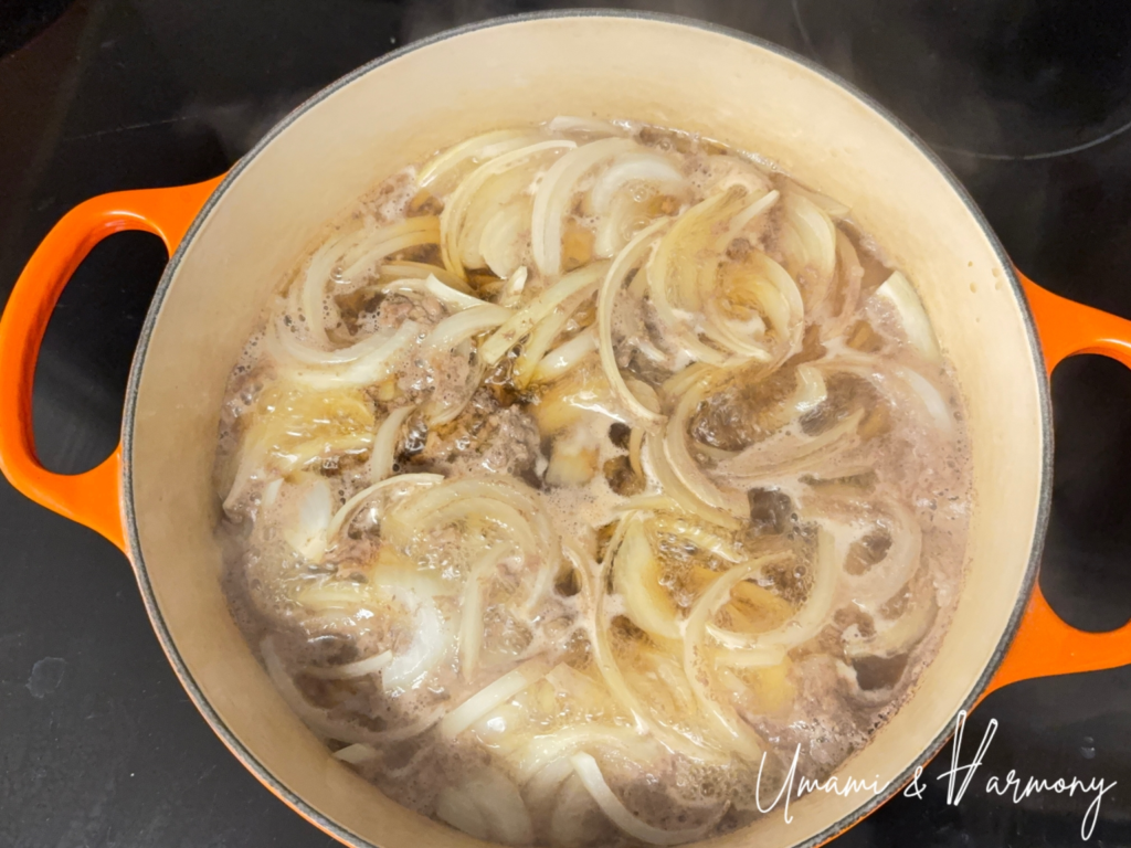 Cooking beef and onion in a dutch oven