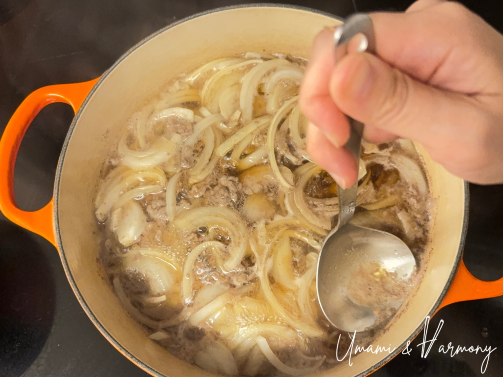 Skimming foam and impurities from beef and onions