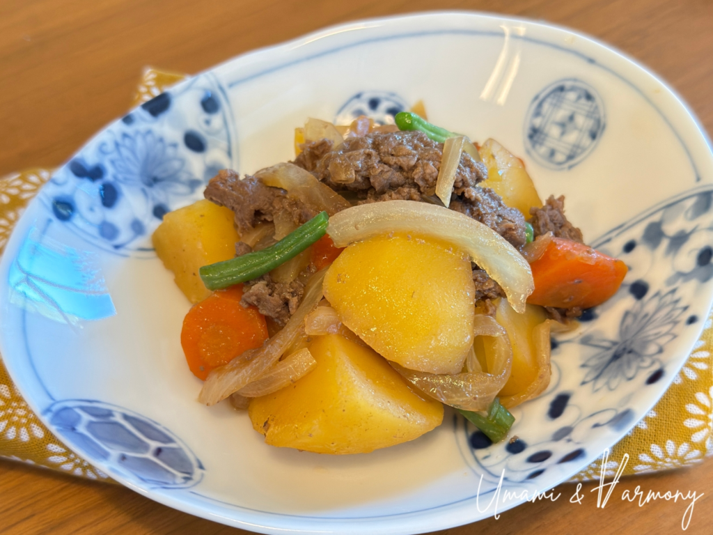 Nikujaga served in a small tray, ready to eat