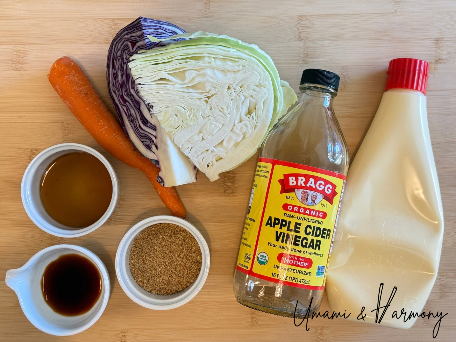 Ingredients for sesame coleslaw: shredded cabbage, red cabbage, carrot, apple cider vinegar, mayonnaise, ground roasted sesame, honey, and soy sauce