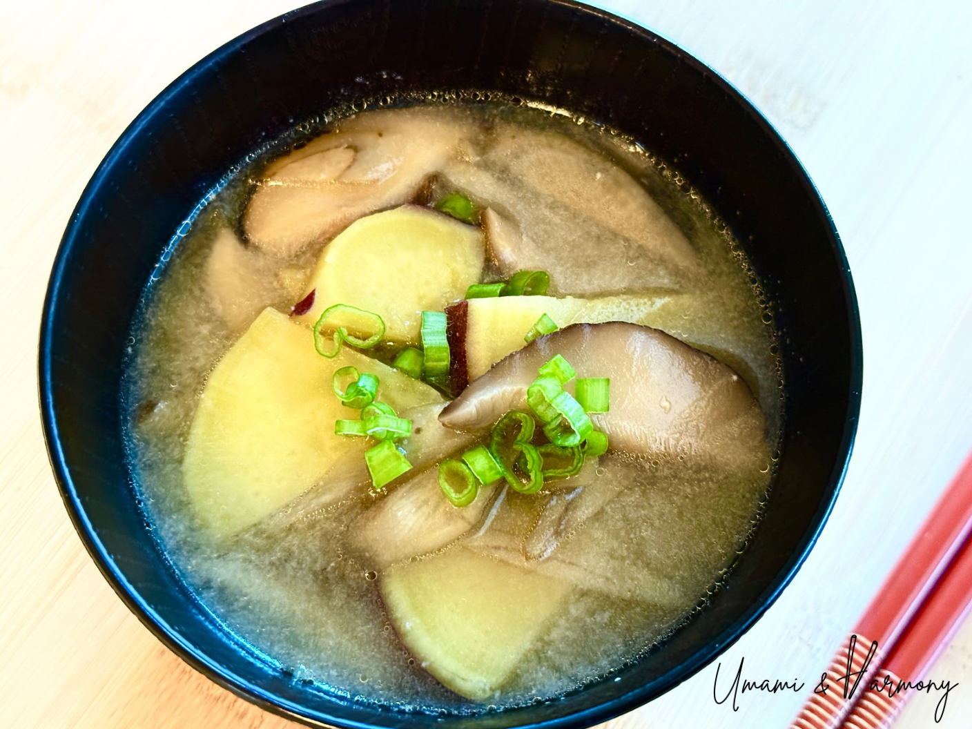 Vegan miso soup served in a Japanese soup bowl topped with green onion