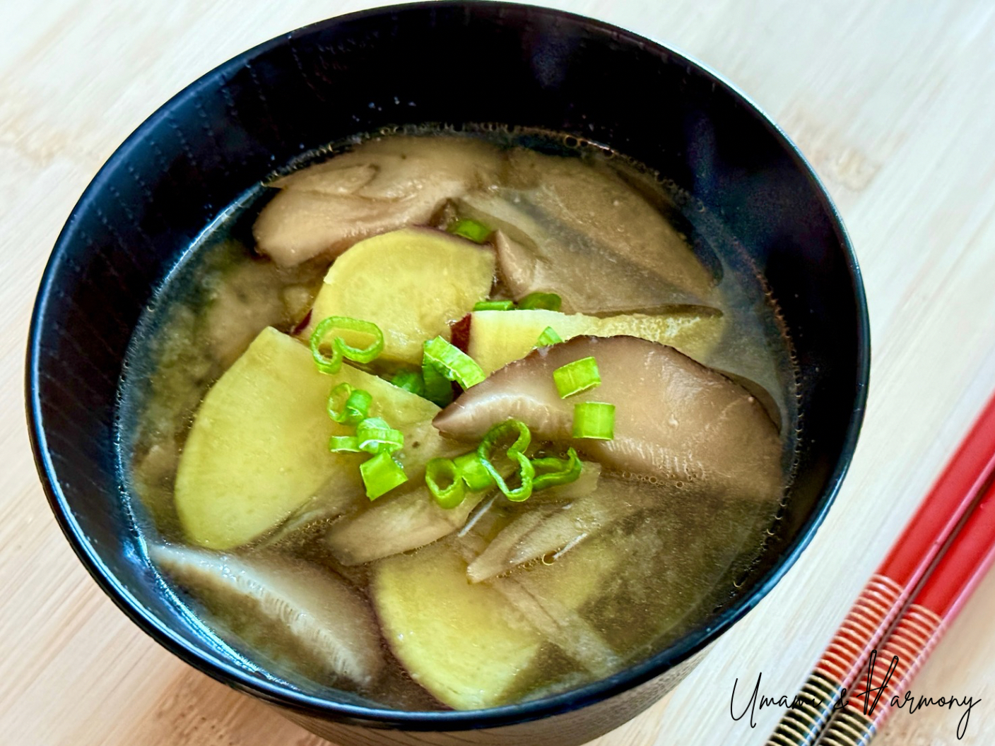 Vegan miso soup served in a bowl with green onions on top
