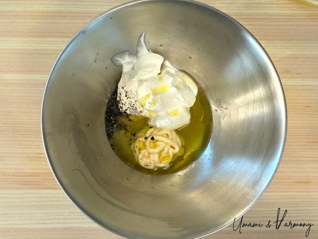 Sour cream, olive oil, mayo, salt, and pepper in a small bowl