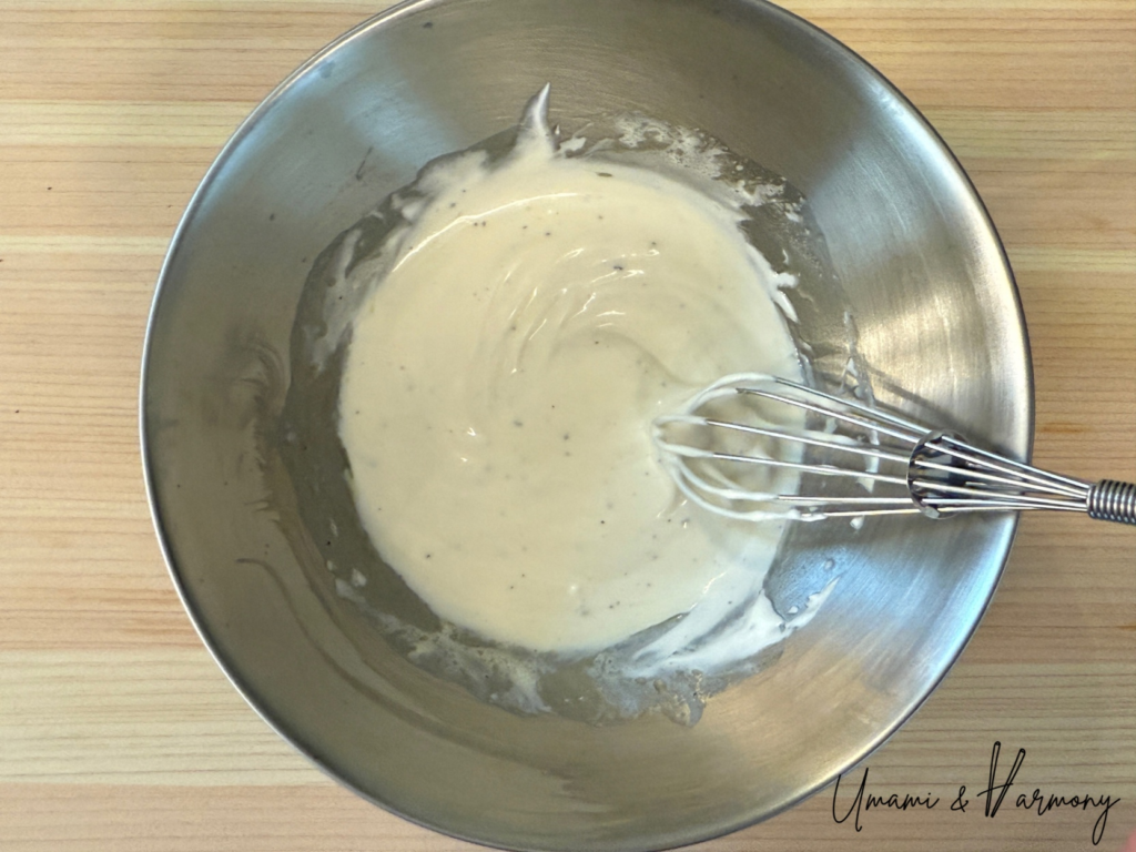 Whisk mixing beet salad dressing