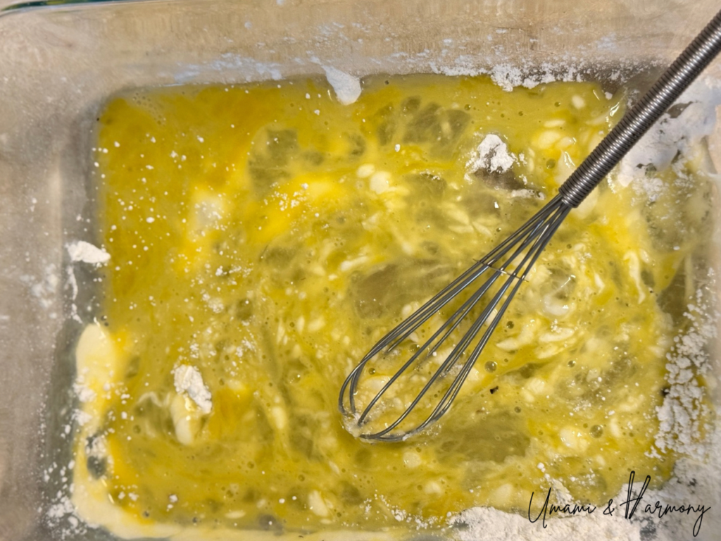 Egg beaten in a bowl with leftover flour