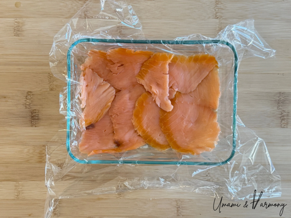 Smoked salmon slices neatly arranged without gaps