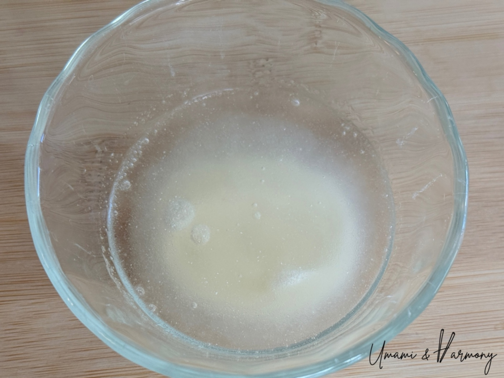 Gelatin blooming in water in a small bowl