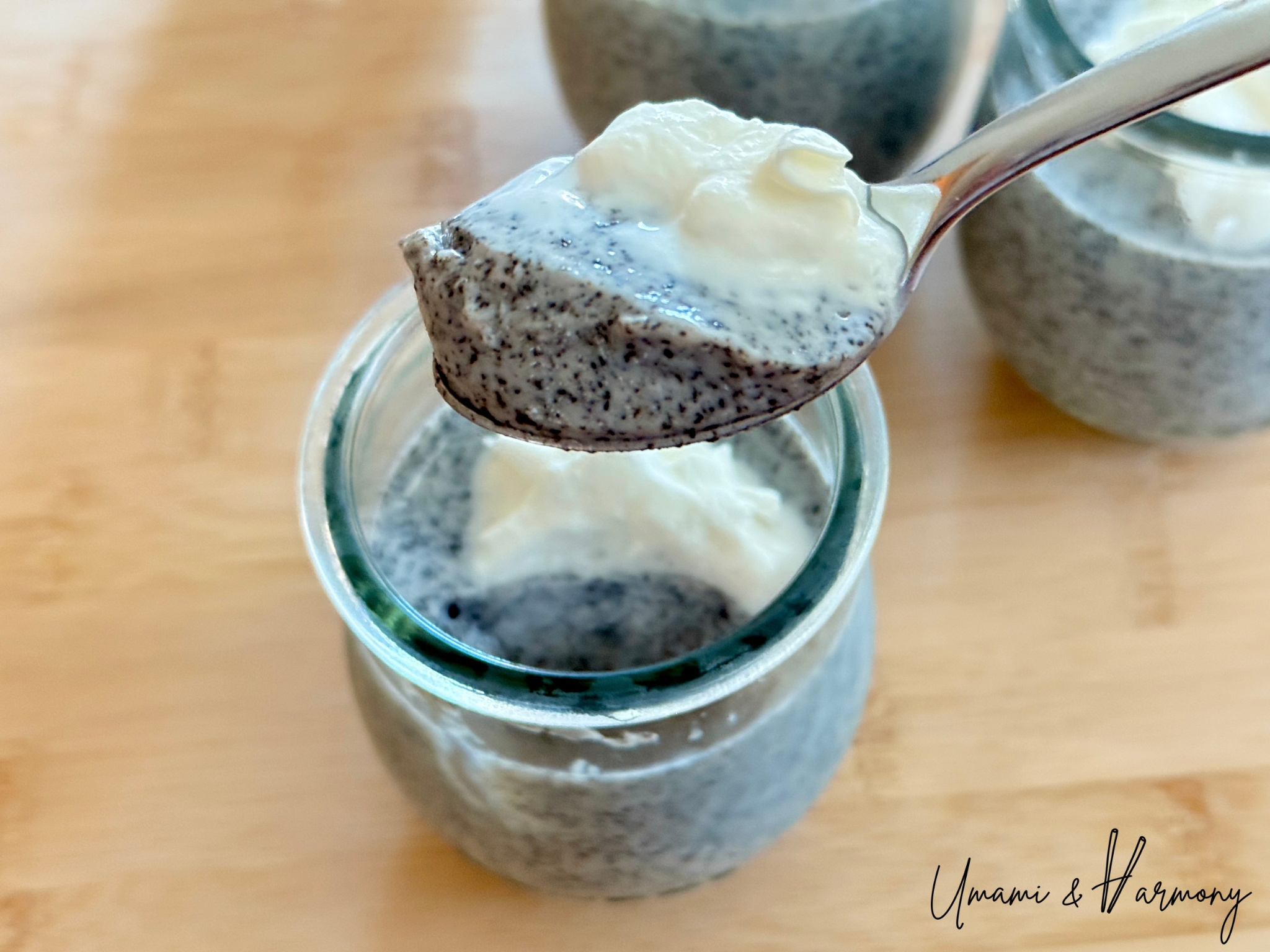 Chilled black sesame pudding topped with whipped cream and ready to serve