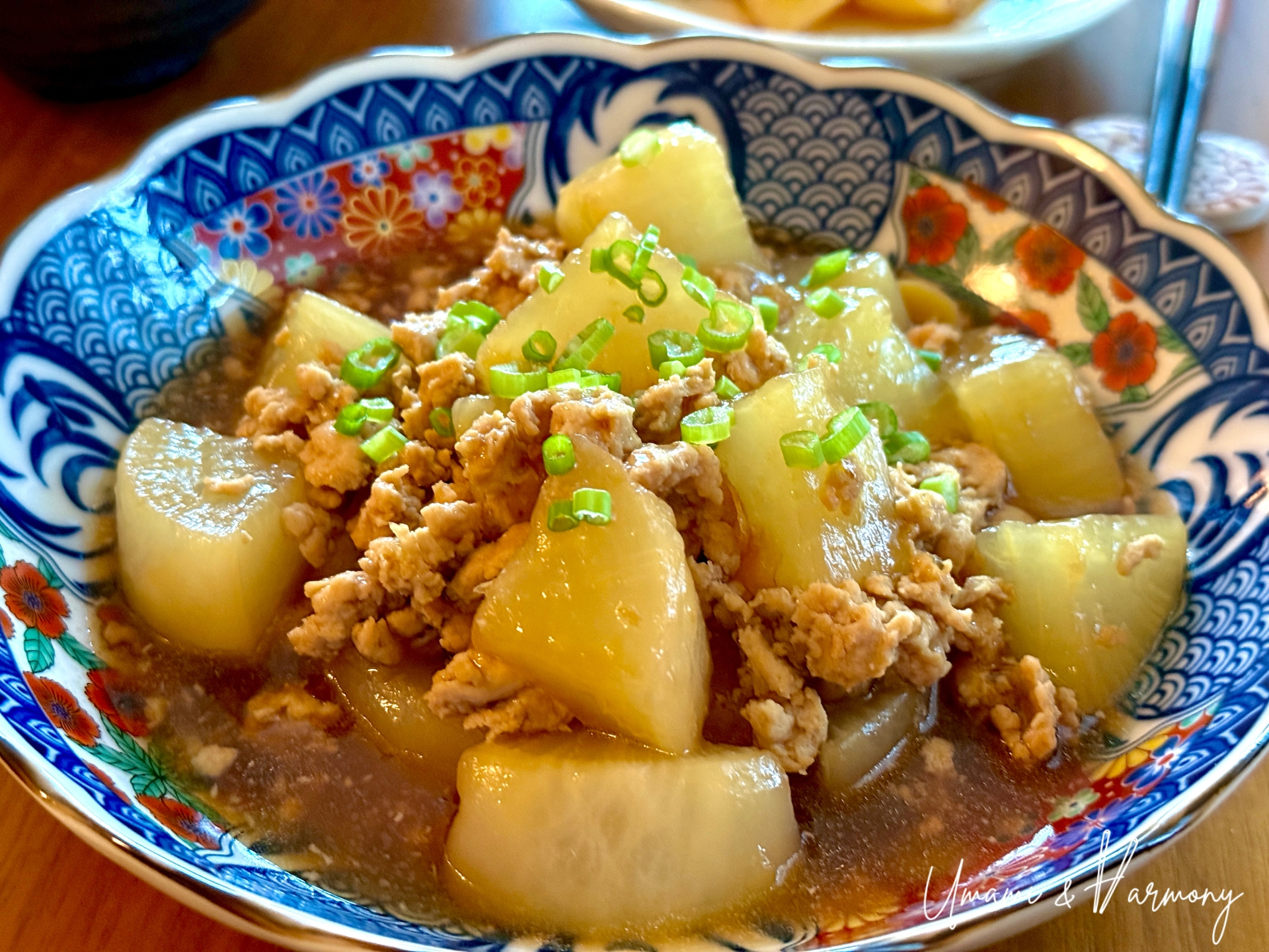 Simmered daikon with chicken soboro served in a bowl