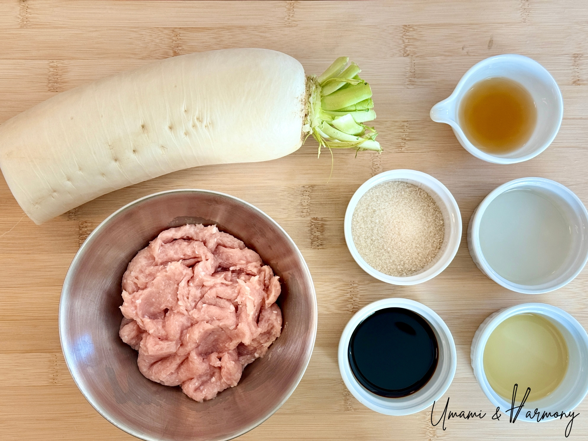 Ingredients for simmered daikon with chicken soboro including daikon radish, ground chicken, soy sauce, mirin, sugar, sake and sesame oil. 