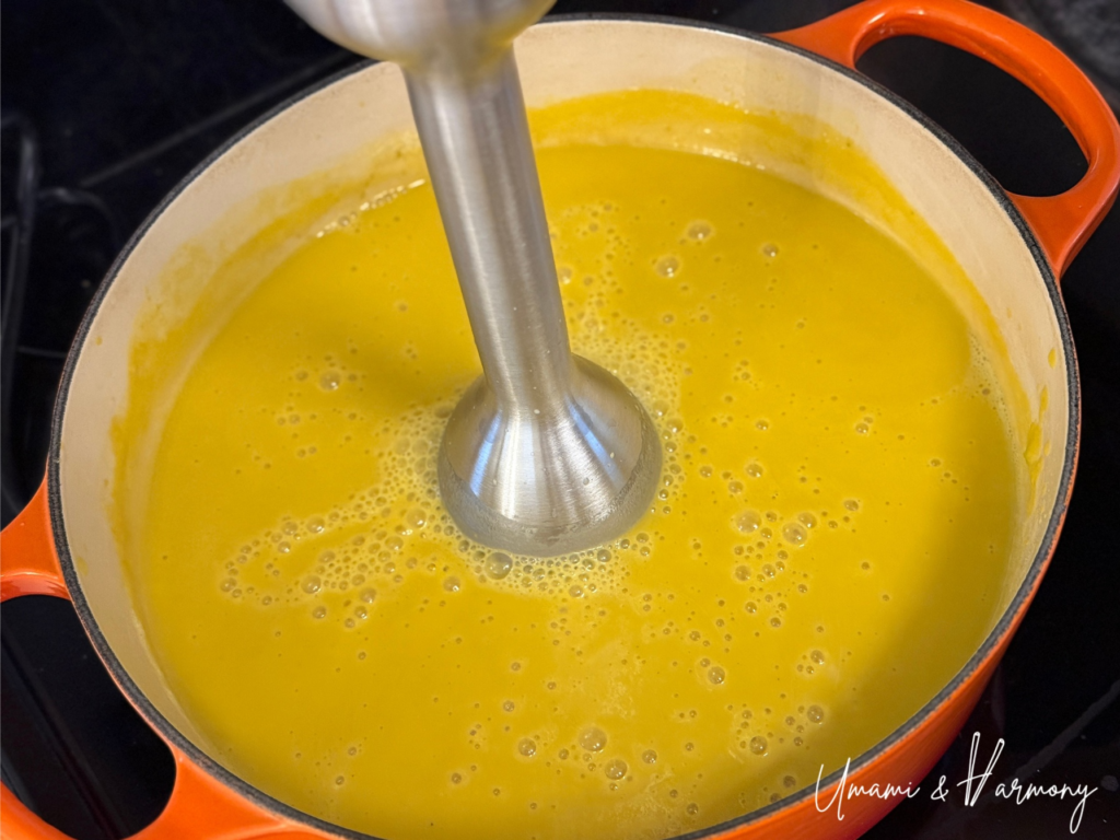 Immersion blender pureeing the kabocha squash soup 