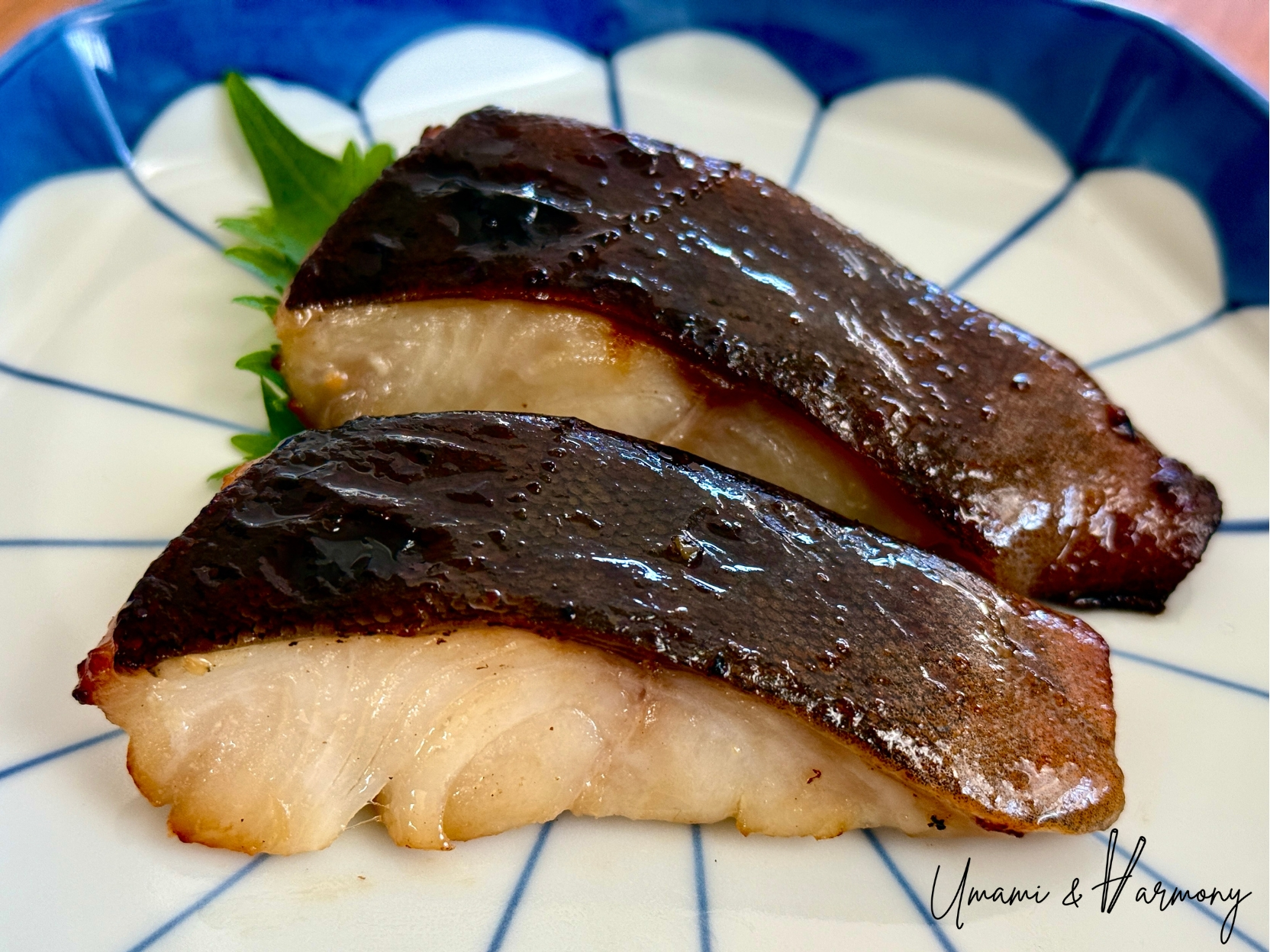 Miso-marinated black cod served on a plate with a glossy caramelized surface