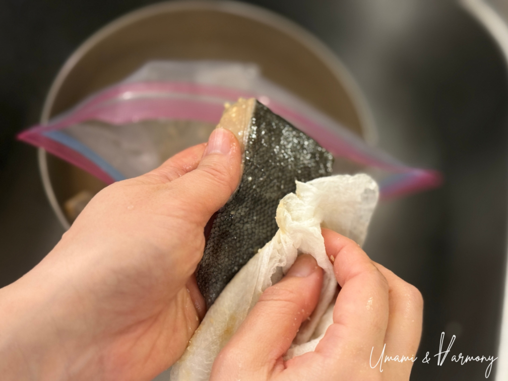 Excess miso wiped off black cod before baking