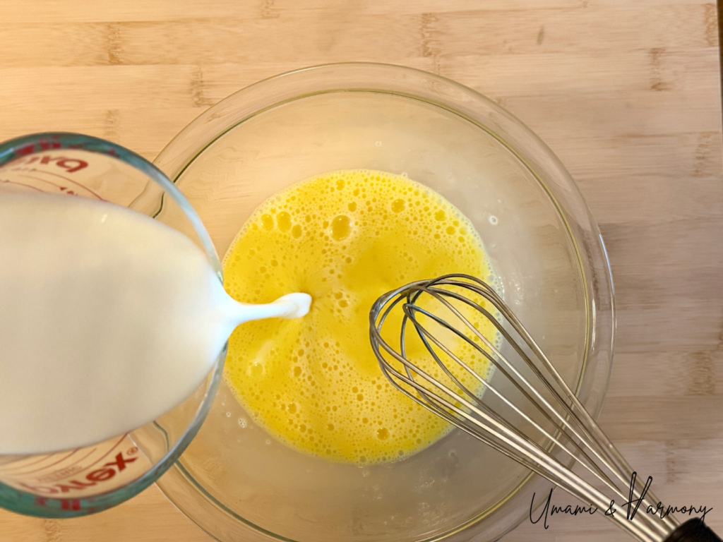 Milk, sugar, and vanilla extract added to beaten eggs for Purin