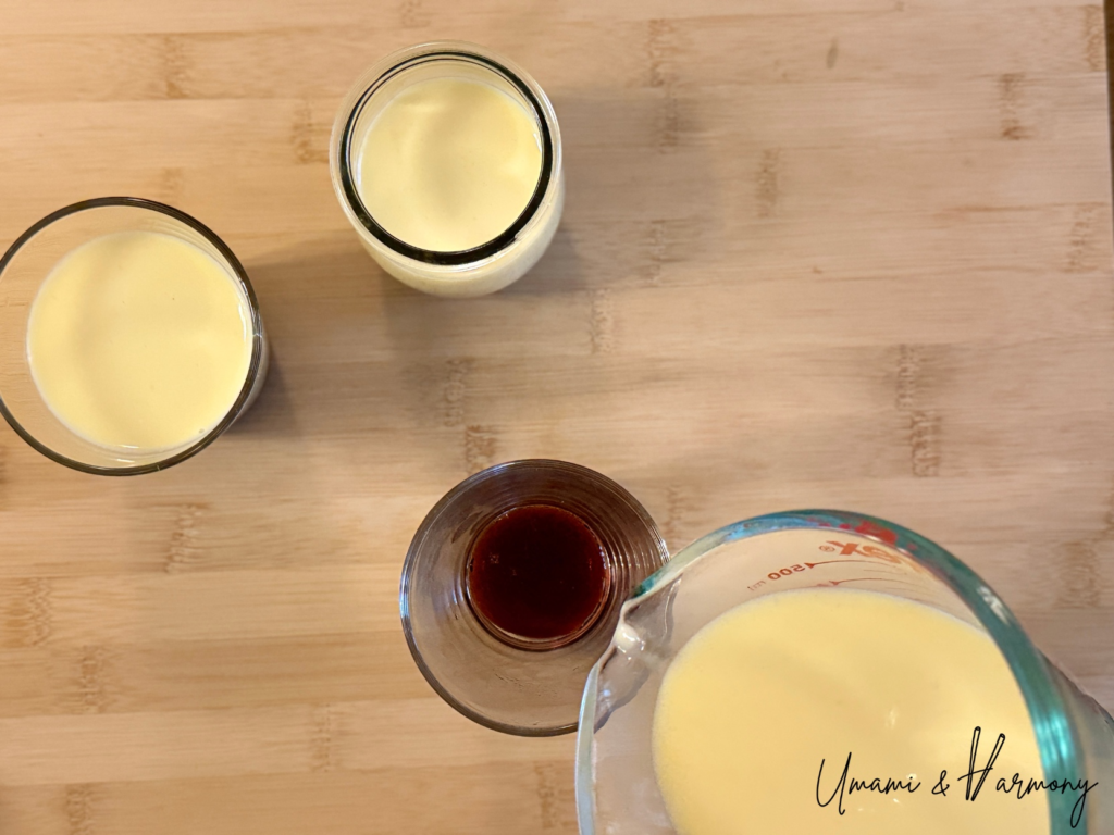 Pouring Purin custard mixture into cups over caramel sauce