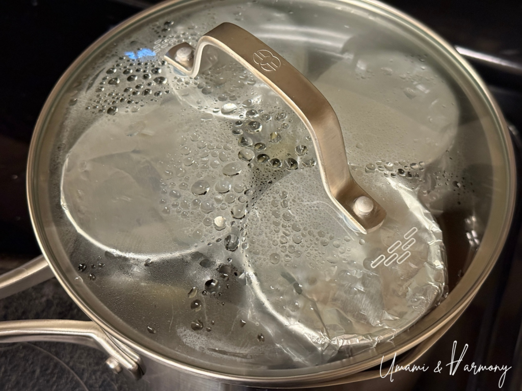 Purin being gently steamed in a pot over low heat