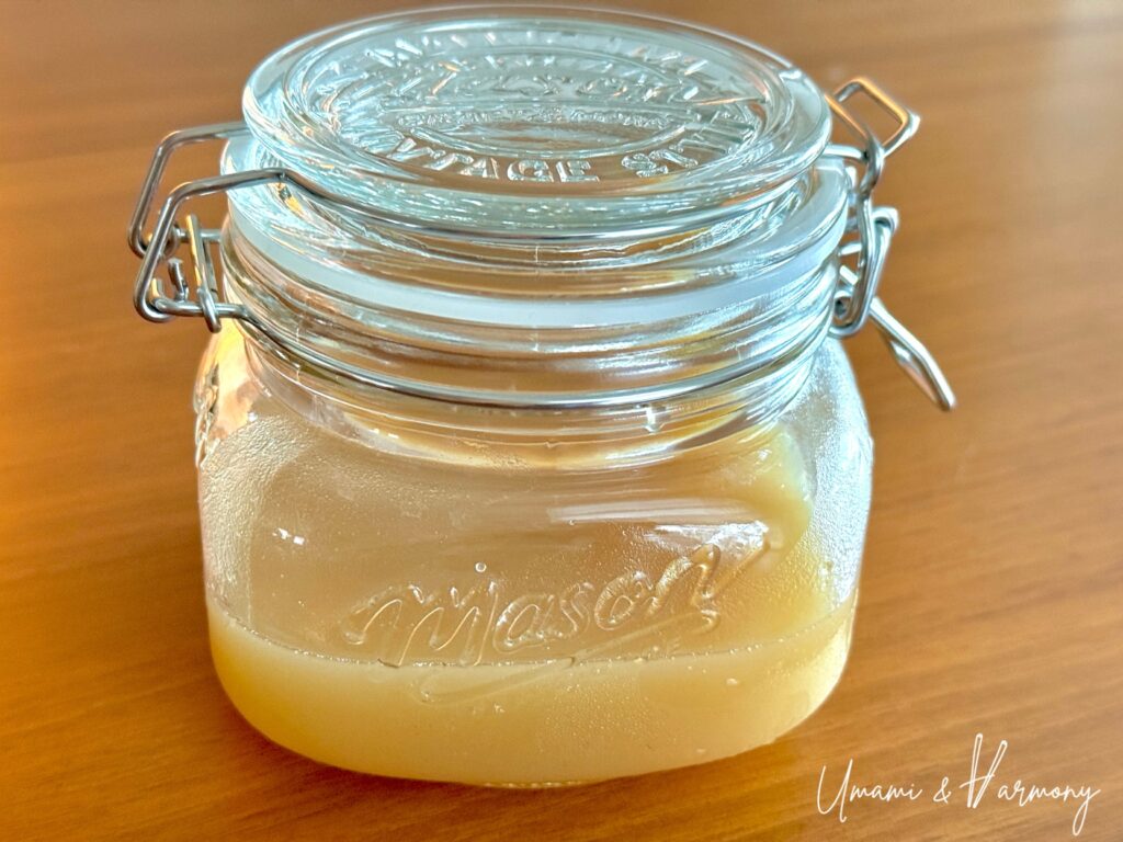 Homemade ginger syrup in a glass jar