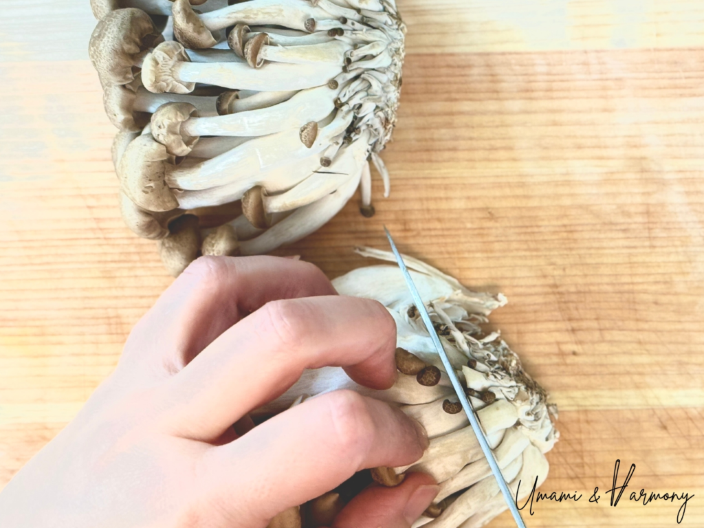 Root ends of shimeji mushrooms being removed
