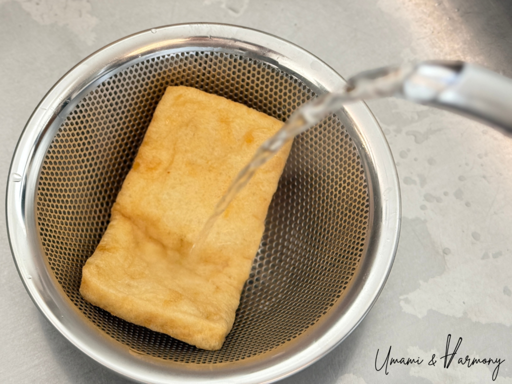 Abura-age being rinsed with boiling water to remove excess oil
