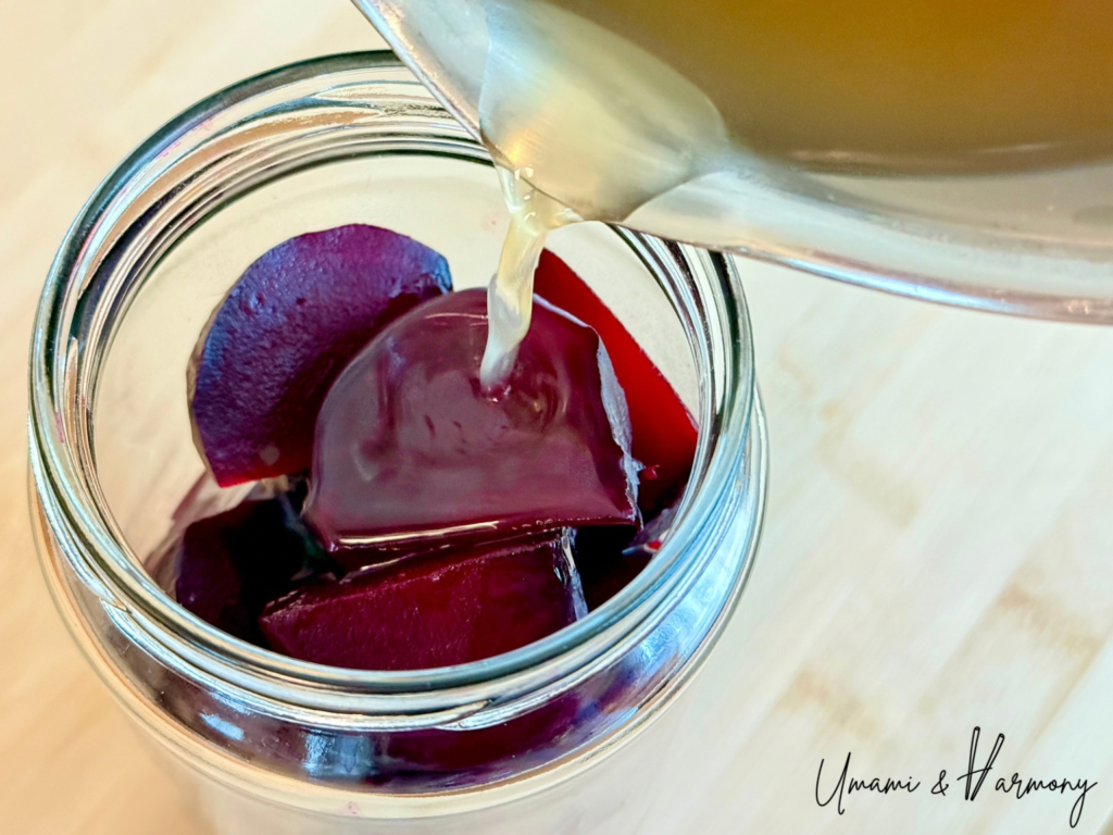 Rice vinegar and sushi seasoned vinegar being poured over beets