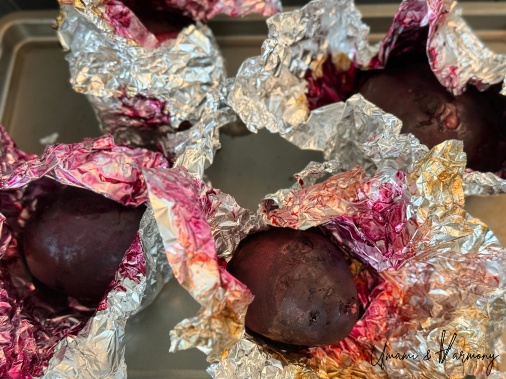 Cooked beets being unwrapped to cool down