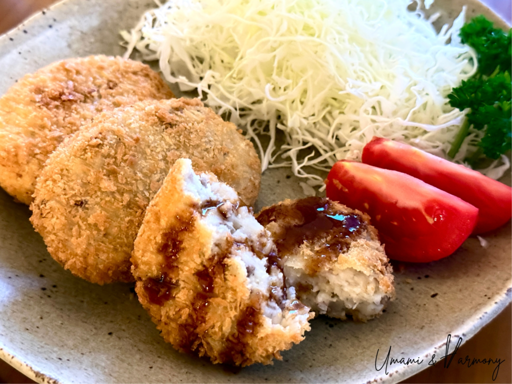 Japanese Potato Croquette with sauce poured on top