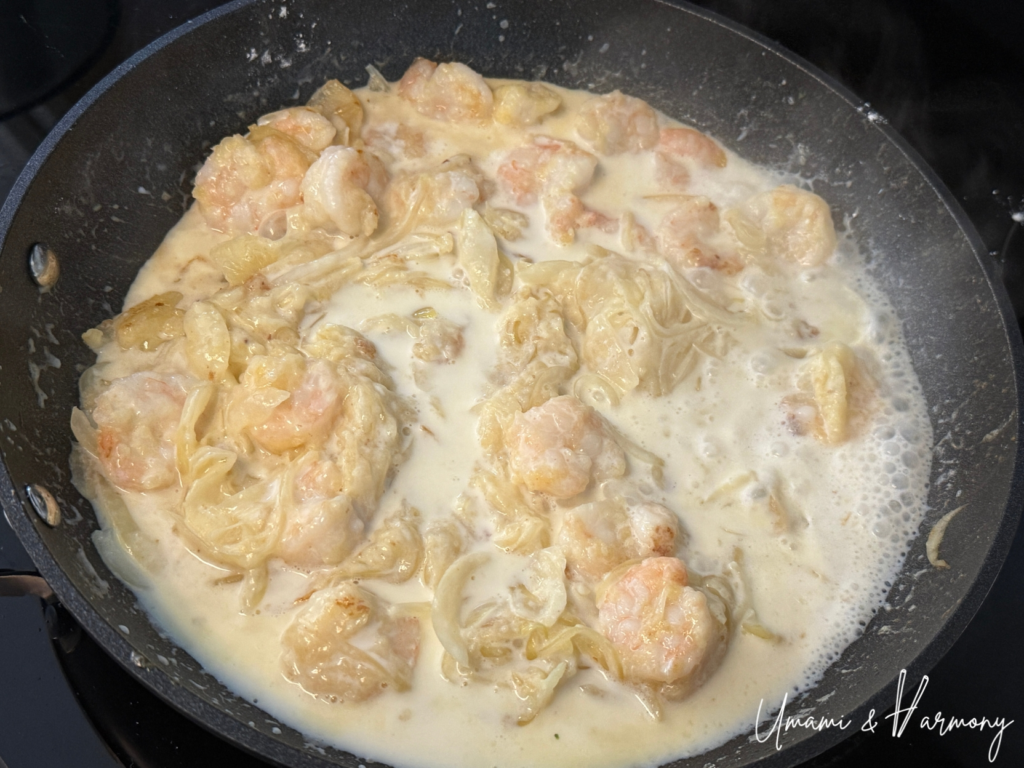 Milk being added to create a creamy white sauce