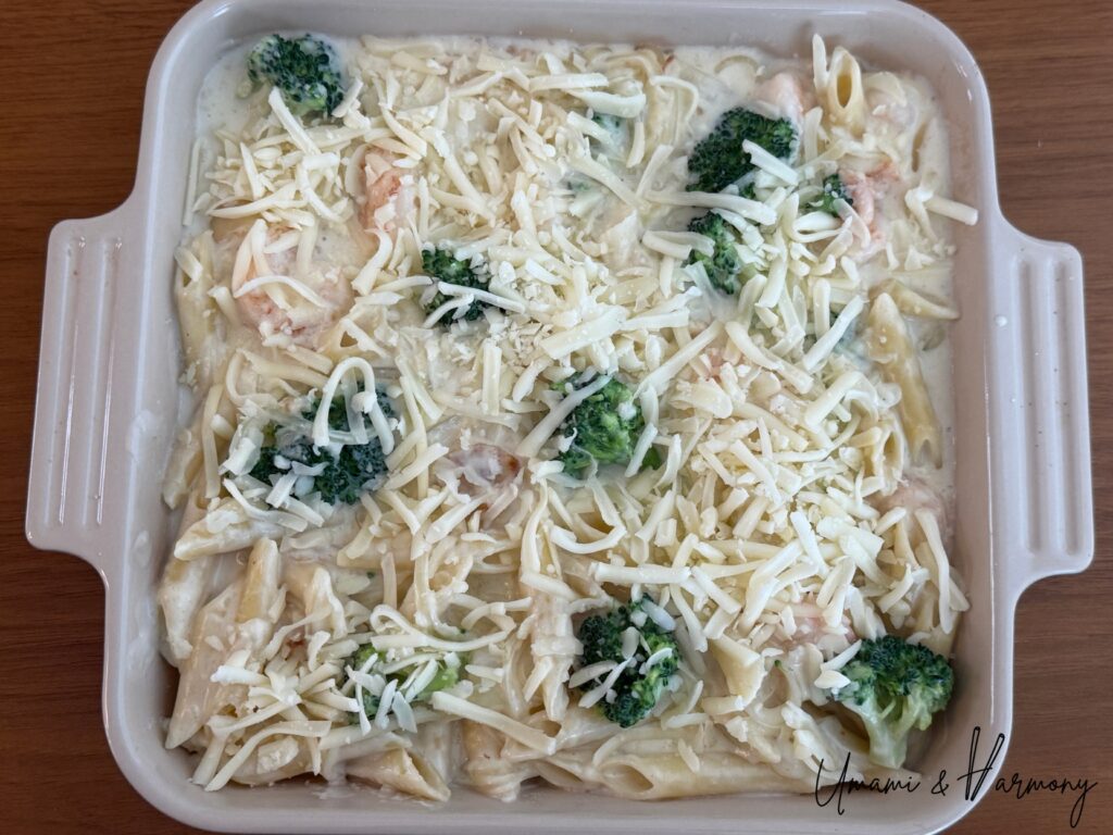 Shredded cheese sprinkled evenly over the gratin