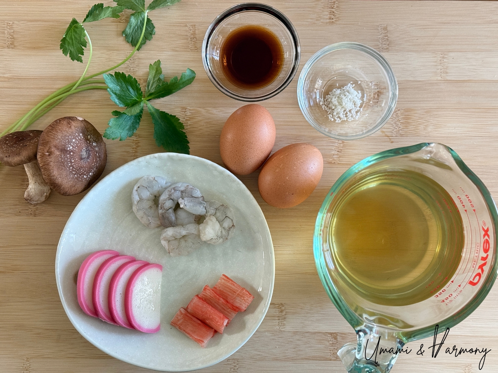Ingredients for chawanmushi including eggs, dashi, seasalt. light soy sauce, shrimp, imitation crab sticks, shiitake mushrooms, and kamaboko