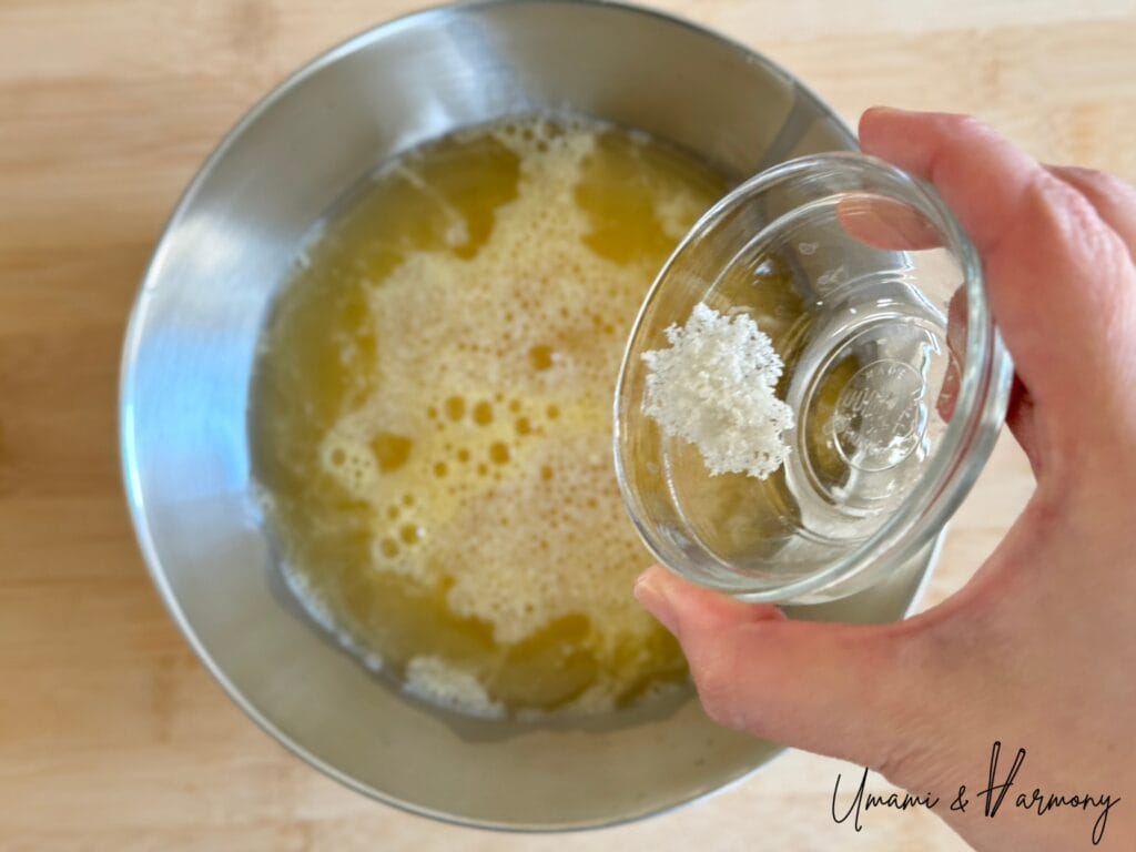 Sea salt being added to egg mixture